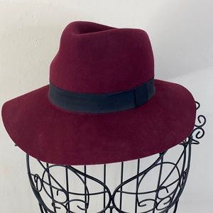 Burgundy hat with black trim around